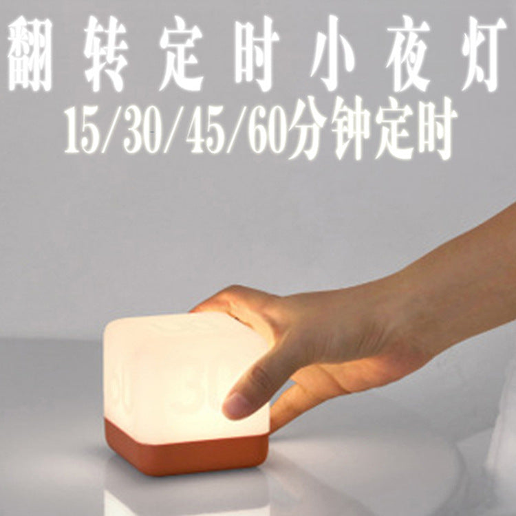 USB rechargeable compact LED cube light on desk