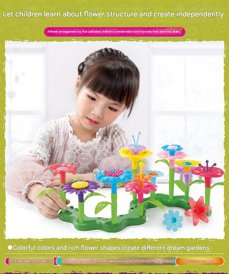 child’s hand assembling plastic garden blocks