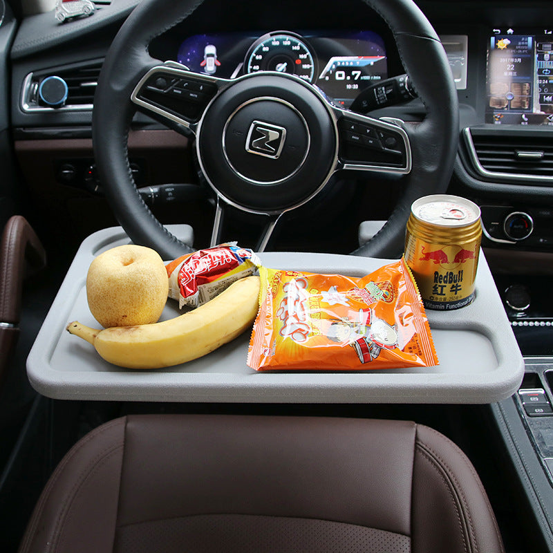 grey car desk mounted on steering wheel