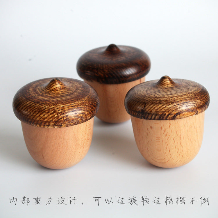 rotating wooden acorn music box close-up