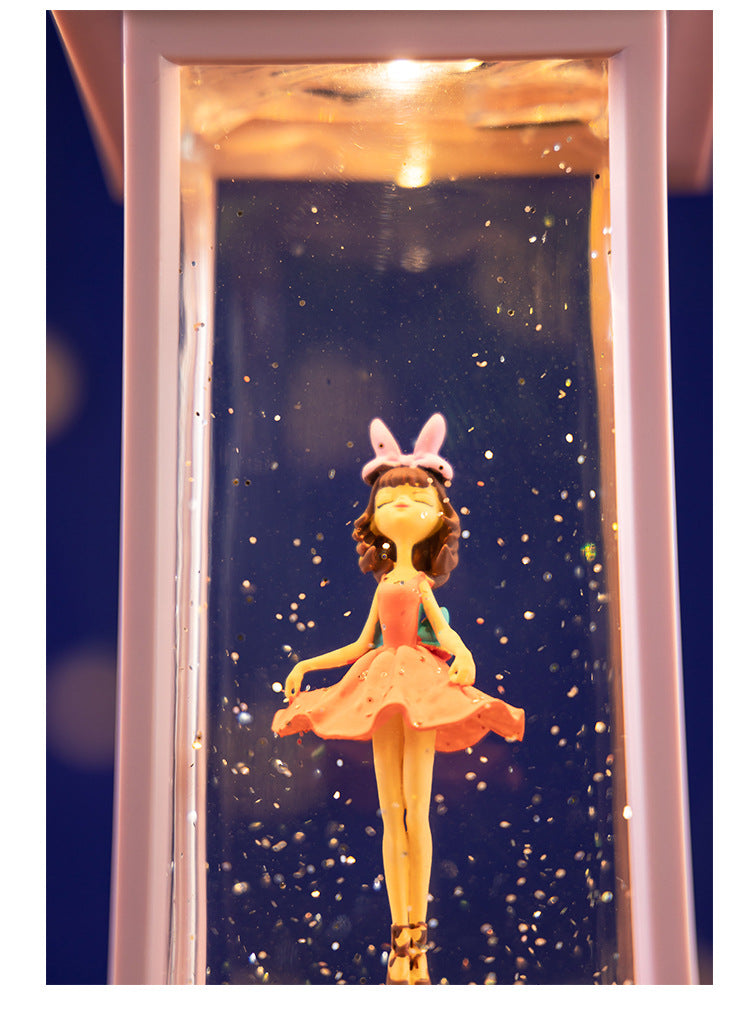 Ballet dancer inside clear snow globe rotating image 1