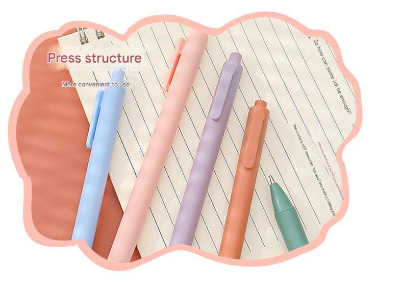 stylish macaron colored gel pens on desk