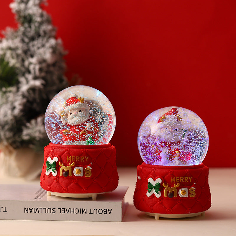 Glowing festive snow globe at night