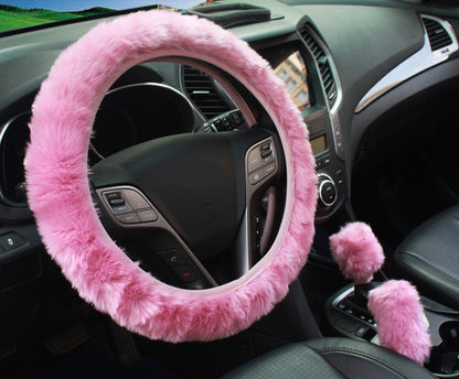 plush pink steering wheel cover in car