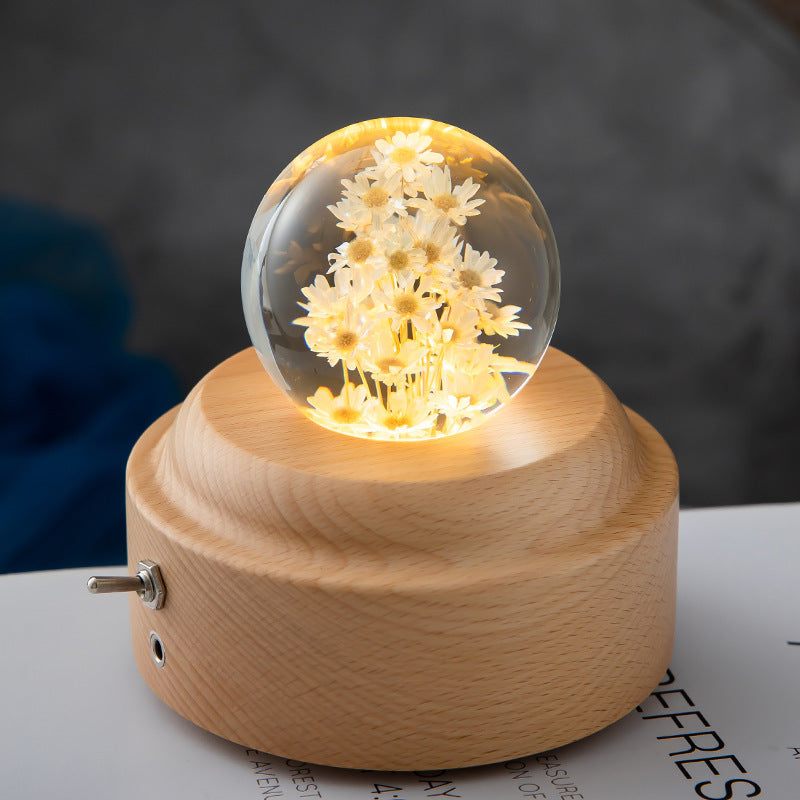 artistic LED-lit dandelion crystal ball on wooden stand