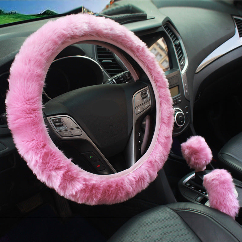 purple fur steering wheel cover in automobile setting