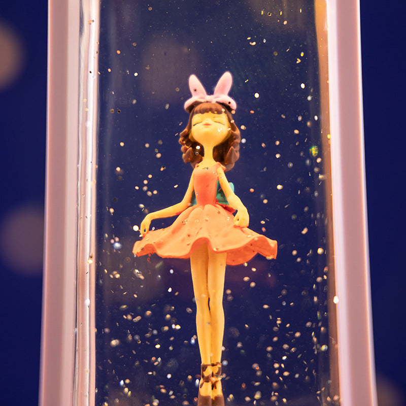 Close-up view of rotating ballet dancer in snow globe image 4