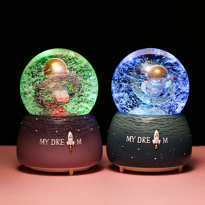 Cosmic-themed music box with floating astronaut