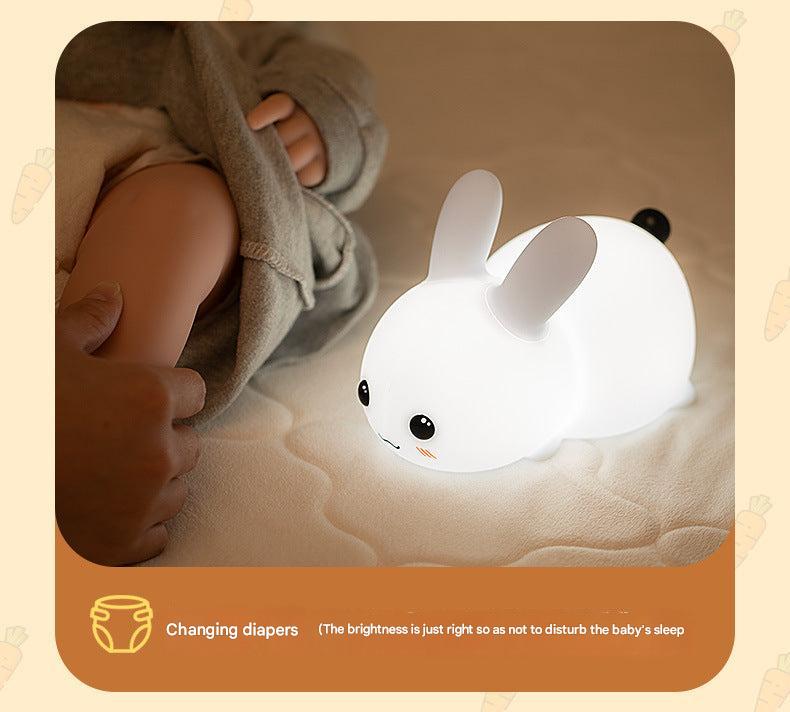 Interactive silicone rabbit night light in a child's room