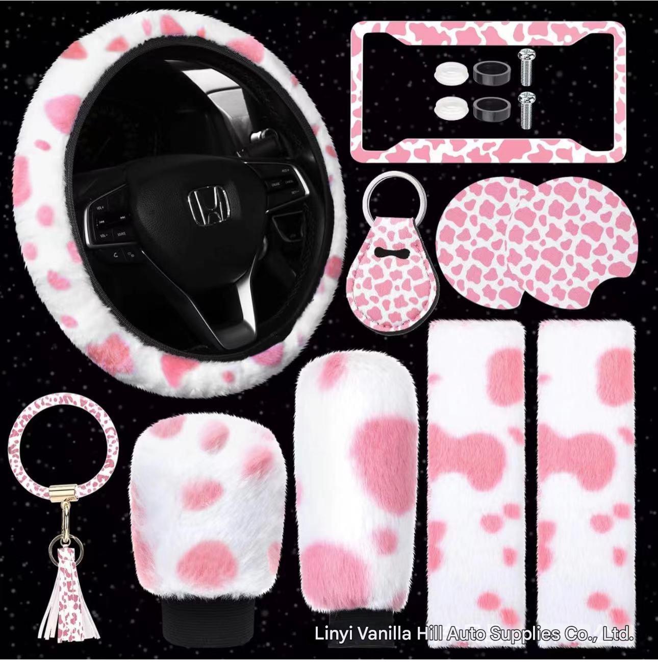 pink and white plush car accessory set with keychain and cup mat